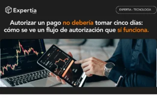 Ejecutivo revisando gráficas financieras en una tablet, que ilustra un flujo de autorización de pagos digital y trazable